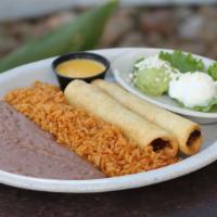Flautas de Pollo · 2 lightly fried flour tortillas filled with shredded chicken. Served with guacamole, sour cr...