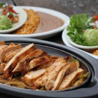 Fajitas For 2 · Beef or chicken sizzling on a bed of grilled onions and bell peppers. Served  for 2 with ric...