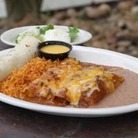 Monterrey Dinner · A beef fajita taco, a tamale, 1 beef, and 1 cheese enchilada topped with chili gravy. Served...