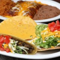 Presidente Deluxe · 2 cheese enchiladas topped with chili gravy. Served with guacamole, a bean chalupa, a beef t...