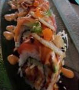 Lifesaver Roll · In: tempura bacon, snow crab, cucumber. Out: fresh salmon, avocado, lemon, scallion, masago, spicy mayo, eel sauce. May contain raw or undercooked ingredients.
