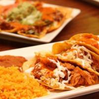 Tacos Azteca  · Three crispy hard shell tacos with choice of protein. Topped with lettuce, sour cream, chees...