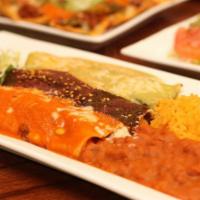 Enchiladas Mi Bandera  · Three soft corn tortillas, one rolled with cheese, one with chicken and another with beef, t...