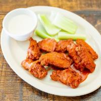 Red Hot Wings · Chicken wings served with frank’s red hot or sweet baby ray’s BBQ, celery sticks and blue ch...