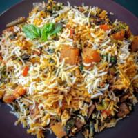 Veg Biryani · Aromatic basmati rice simmered cooked with vegetables, spices and nuts flavored with saffron.