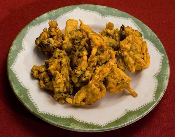 Vegetable Pakora · Vegetable fritters delicately spiced. Served with homemade mint chutney and hot and sour tamarind chutney.