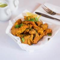 Fish Pakora · Fresh fish marinated with clay oven spices. Served with homemade mint chutney and hot and so...