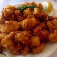 Calamari Pakora · Lightly-spiced calamari dipped in chickpea batter. Served with homemade mint chutney and hot...