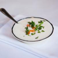 Raita · Homemade yogurt with cucumber and carrots mixed with spices.