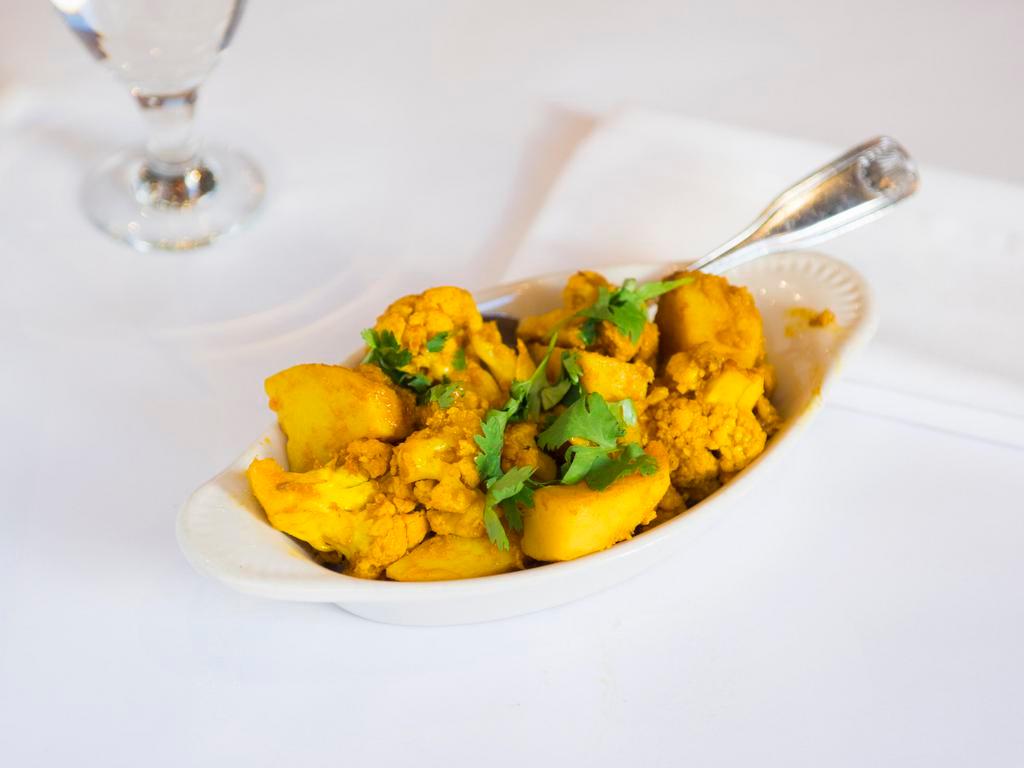 Aloo Gobi · Fresh cauliflower and potatoes cooked with herbs and spices.