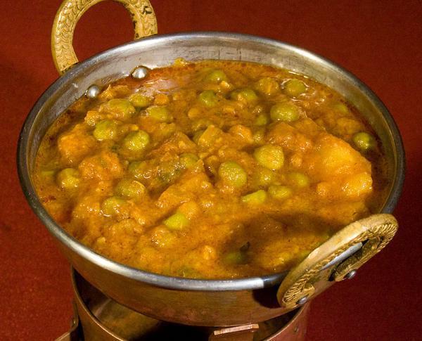 Aloo Mattar · Fresh green peas and potatoes cooked with chopped onions, tomatoes and spices.