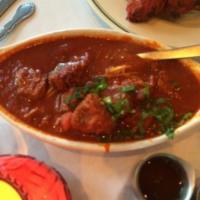 Lamb Vindaloo · Lamb cooked with fresh potatoes and spicy hot source.