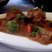 Lamb Jal-Frazzie · Tender lamb pieces pan fried with a potpourri of chopped assorted vegetable.