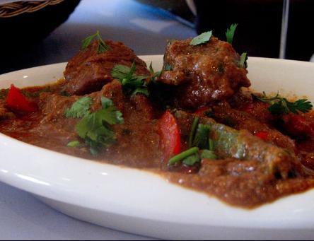 Lamb Jal-Frazzie · Tender lamb pieces pan fried with a potpourri of chopped assorted vegetable.