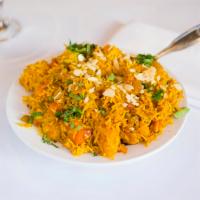 Vegetable Biriyani · Saffron flavored basmati rice with vegetables and nuts.