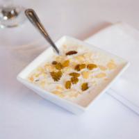 Kheer (Rice Pudding) · Dessert made from basmati rice cooked with sugar, milk and served cold with almonds and pist...
