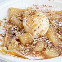 Caramel Apple Crepe · Apple pie crepe topped with powdered sugar, cinnamon, crushed walnuts, vanilla ice cream and...