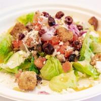 Almost Greek Salad · Romaine lettuce, mushrooms, tomato, red onion, feta cheese, kalamata olives, croutons and ho...