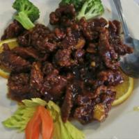 H16. Orange Flavored Beef · Crispy chunts of boneless beef sauteed with hot peppers and orange peef in a delicious speci...
