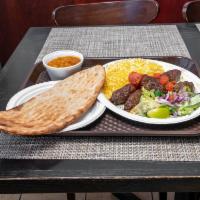 #3. Lamb Kabob · Comes with rice of your choice, salad, bread, and a side of chickpeas, spinach or potato.
