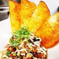 Shrimp Ceviche · Caribbean-style shrimp ceviche, fried taro chips, avocado crema