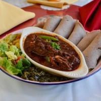 Ye Beg Wet · Lamb stew seasoned and hearty. Comes with berbere (hot pepper) sauce.