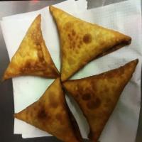 Sambusa · Lightly fried pastries filled with  beef or lentils 