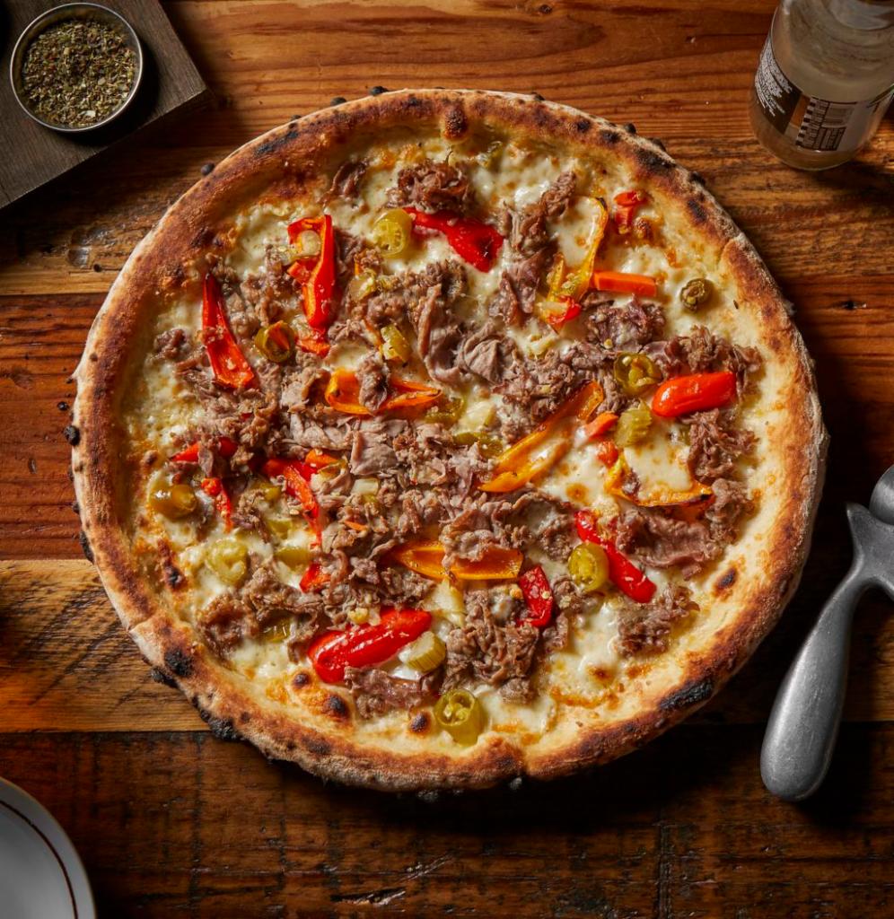 Beefer Sutherland Pizza · Italian beef, provolone cheese, Italian seasoning, and choice of hot giardiniera or sweet peppers.