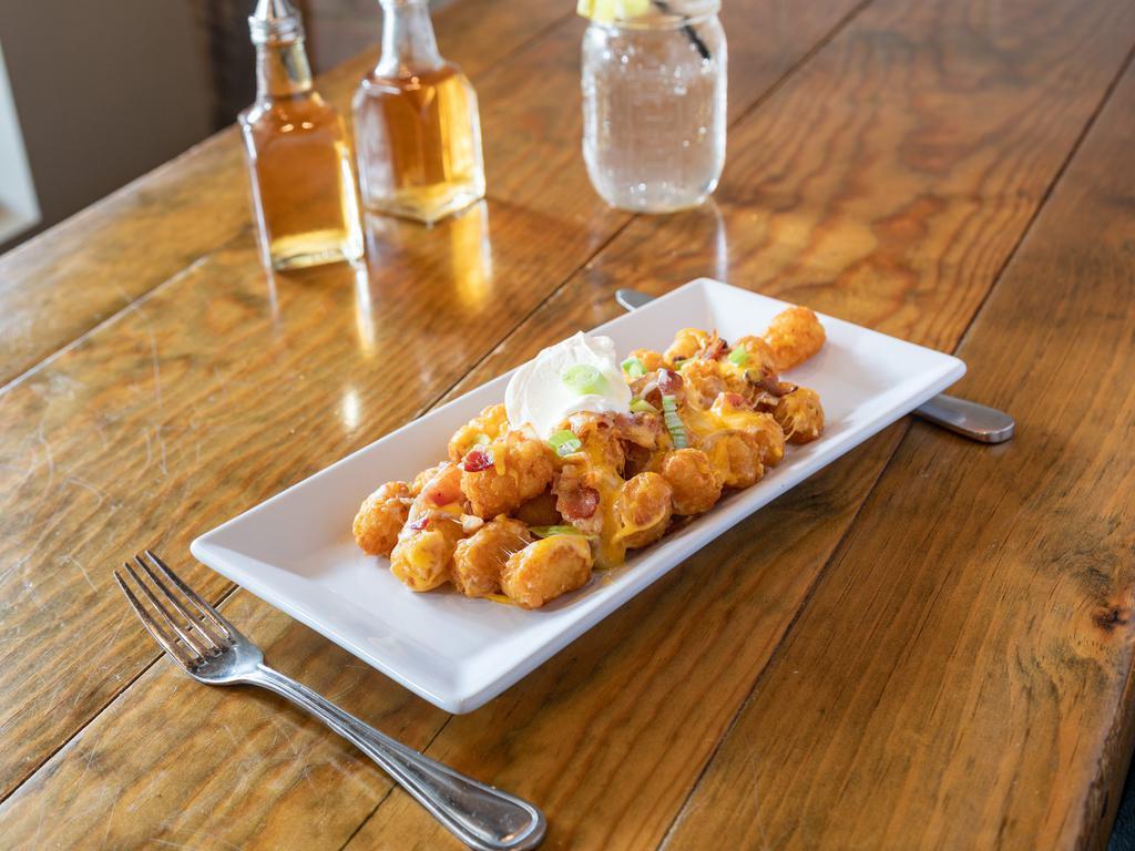 Loaded Tots · Melted Monterey Jack, bacon, scallions and side of sour cream.