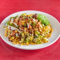 Southwest Chicken Salad · Grilled chicken, bacon, green chiles, red onions, avocado, mixed cheese, roasted com, tortil...