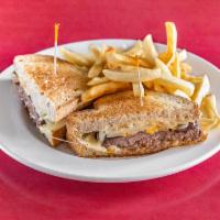 Classic Patty Melt Burger · Grilled thick com rye, beef patty, Swiss cheese, grilled onions and 1000 Island dressing.