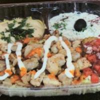 7. Chicken Doner Plate · Basmati rice, taziki, hummus, lettuce, tomato, onions, parsley.
