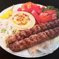 11. Kofta-Kabab Plate · Basmati rice, taziki, hummus, lettuce, tomato, onions, parsley.