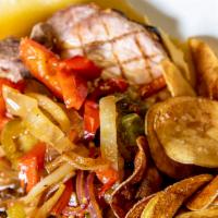 La Fortuna Pork Chops · One bone-in chops, garlic, onion, potatoes, bell, spicy cherry peppers, and white wine.