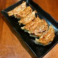 6 Piece Gyoza · Handmade pan-fried pork dumplings.