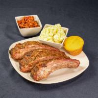 Smoke Beef Rib Plate · Three Juicy smoked ribs served with two sides and choice of bread
