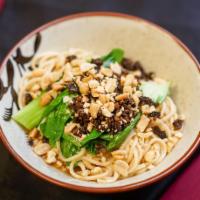 Dan Dan Noodles 担担面 · A well known street dish with soft noodles, simple greens, minced pork, topped with ground p...