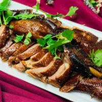 Tea Smoked Duck 樟茶鸭  · House Marinate with chef's special spices & hot smoked over tea leaves 
