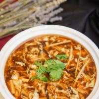 Hot and Sour Soup 酸辣汤 · Baby bamboos, woodears & soft tofu in a hot & spicy egg drop soup