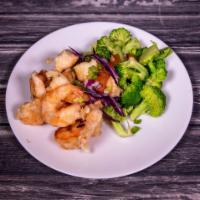 4. Crispy Shrimp · Jumbo shrimp, deep fried, circled with broccoli and topped with a special Hunan sauce. Hot a...