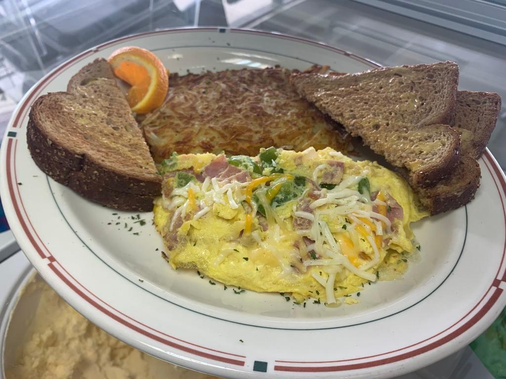 Denver Omelette · Ham, bell peppers, onions, Mexican cheese blend, choice of toast, breakfast potatoes or hash brown.
