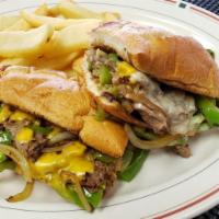 Las Vegas Cheesesteak · Choice of chicken or beef, green peppers, onions, white cheese and hoagie roll.
