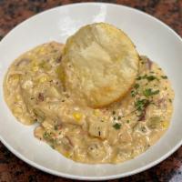 Lobster Pot Pie · Chunks of lobster meat with onions, red-skinned potatoes, corn, and celery simmered until te...