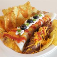 Burrito Platter · Smothered burrito, a side of refried beans, a side of chips and cheese sauce.