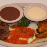 Revuelto Tipico O Ranchero con Carne · Salvadorian traditional breakfast. Served with grilled meat. Servido con platanos, frijoles,...