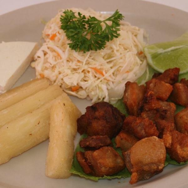 Yuca Frita con Chicharron · Served with pork fried with cabbage and fresh cheese.