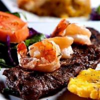 Churrasco con Camarones · Skirt steak with grilled shrimp. Servidos con dos acompanantes у una tortilla: arroz, casami...