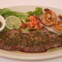 Carne Asada Marimonte · Grilled flap meat with grilled shrimps. Servidos con dos acompanantes у una tortilla: arroz,...