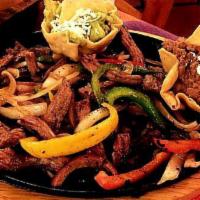 Fajita de Res · Beef fajitas, grilled or in special sauce with peppers, onions, tomato and wine. Servidos co...