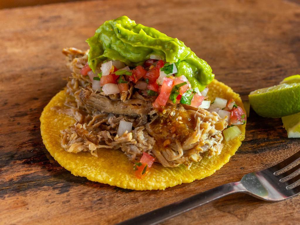 Taco Carnitas · Michoacan style carnitas, salsa, pico de gallo, and guacamole.